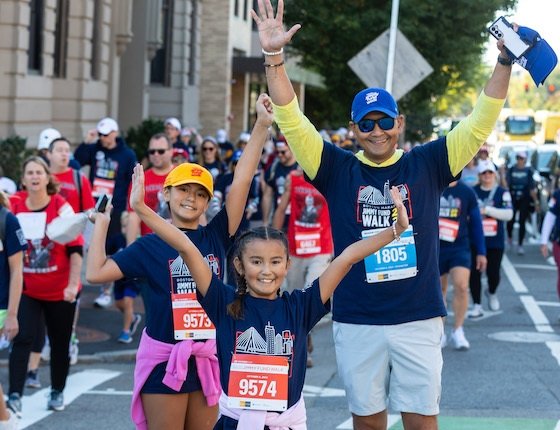 A family participating in the Jimmy Fund Walk on the Boston Marathon course