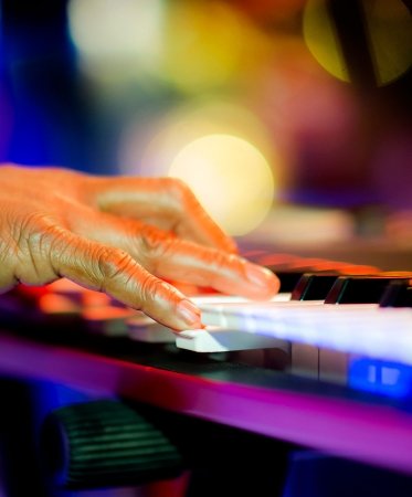 Close-up of someone playing a keyboard