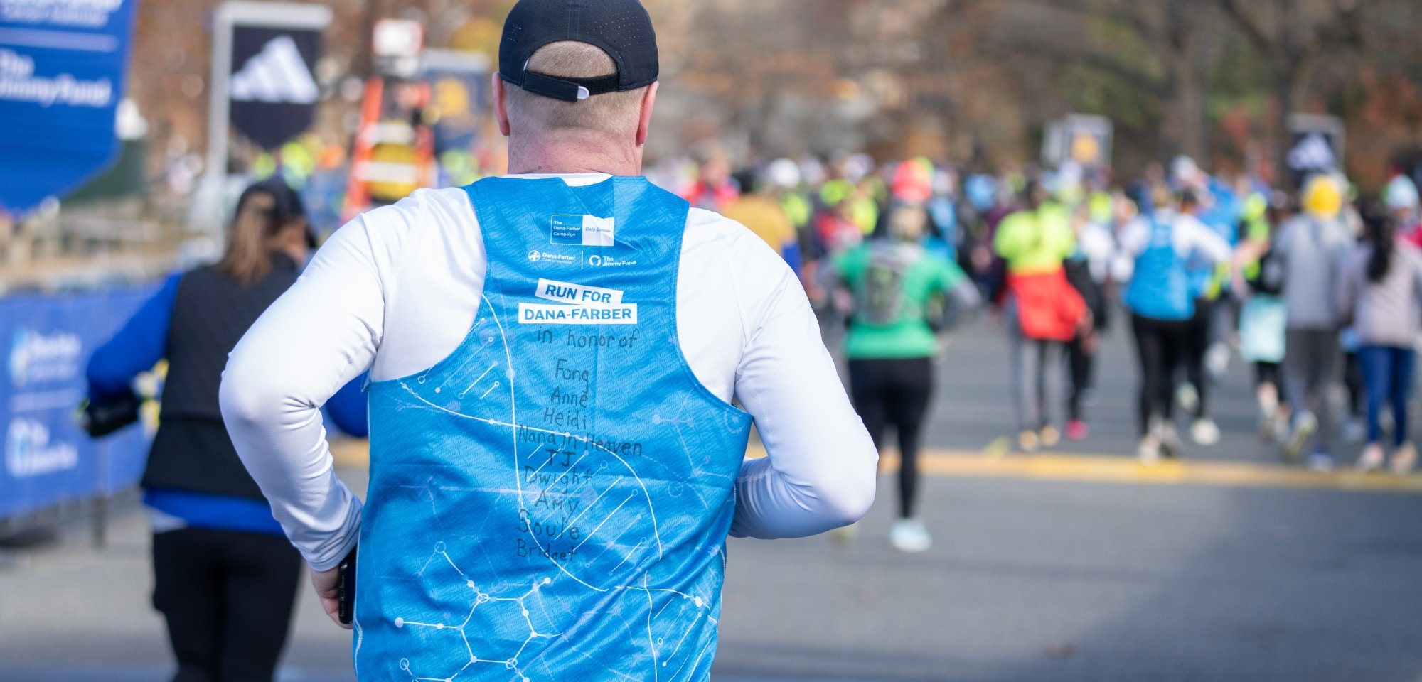 Runner on a race course in a Dana-Farber singlet
