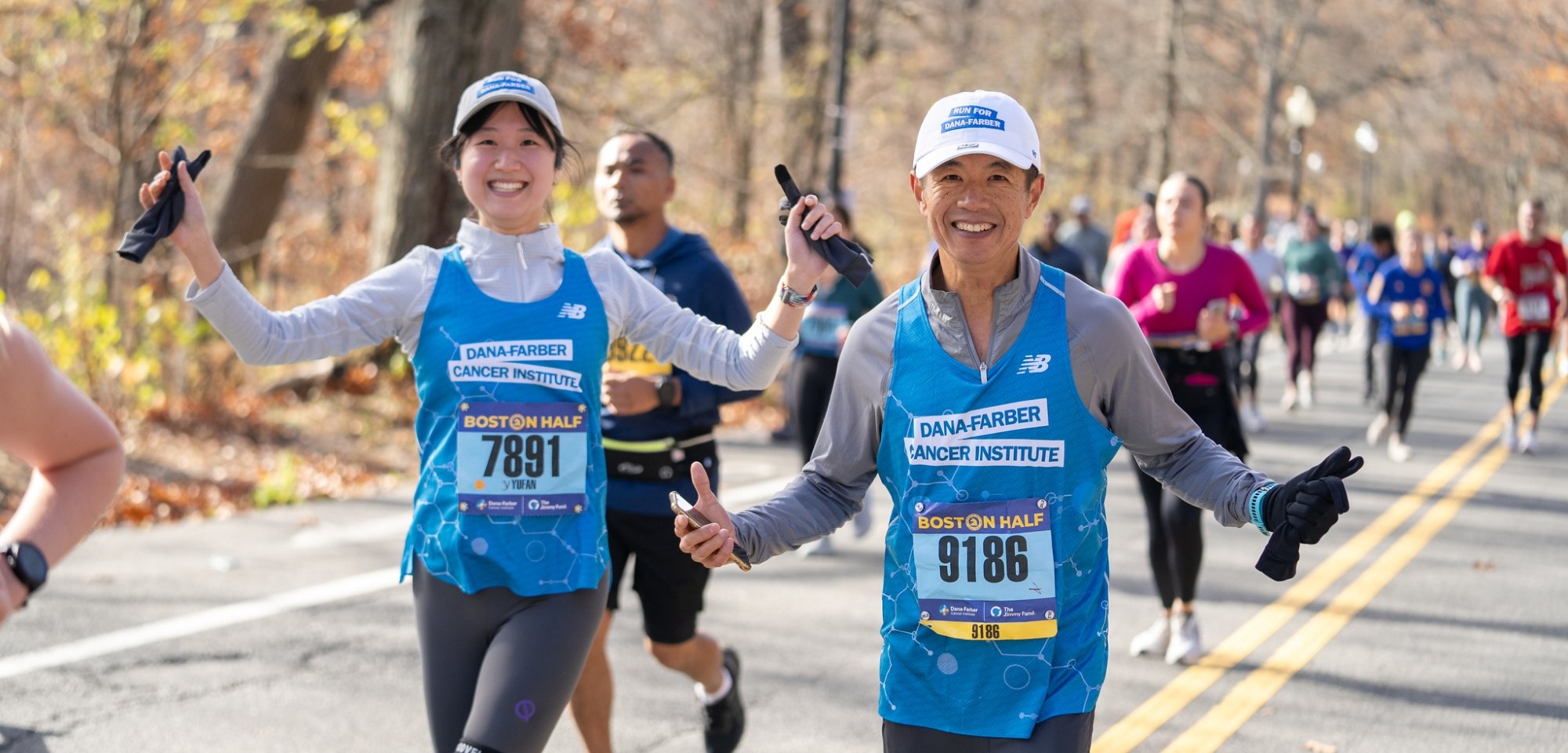Two runners celebrating on a race course