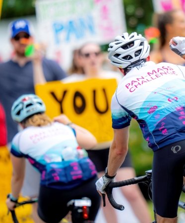 PMC riders bicycling on the road