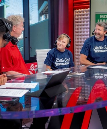 A Dana-Farber pediatric patient speaks with broadcasters at the WEEI/NESN Jimmy Fund Radio-Telethon