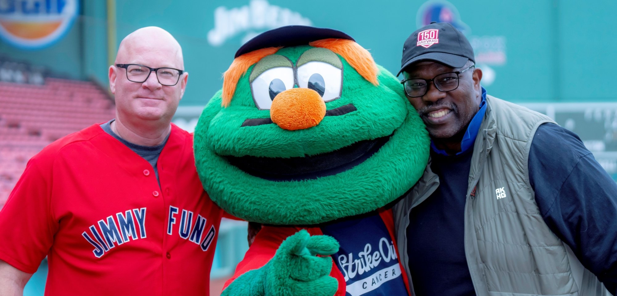 Dana-Farber Cancer Institute supporters pose with Wally the Green Monster at Fenway Park