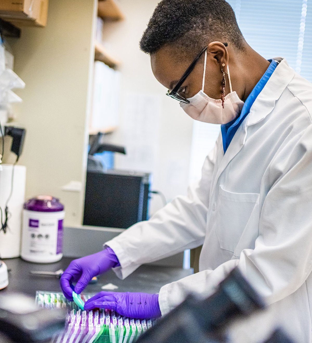 Dana-Farber staff conducting an experiment in a lab