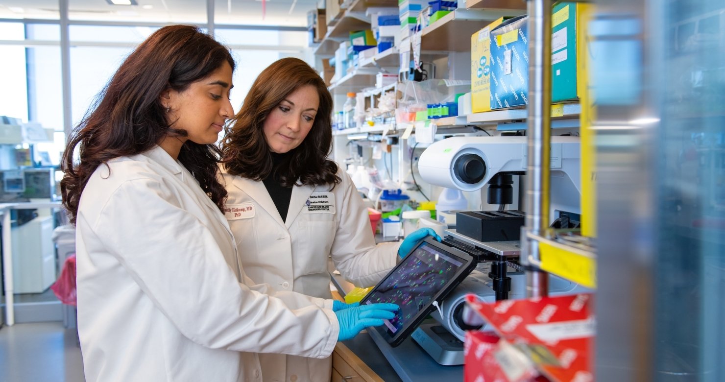 Two Dana-Farber researchers working in a lab