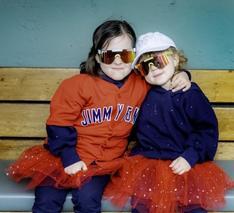 Two children embrace at Fenway Park