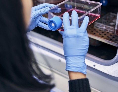 A Dana-Farber researcher using lab equipment