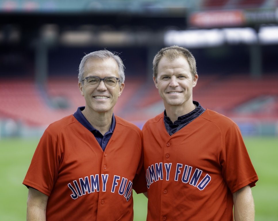 Tom Caron and Brock Holt wearing Jimmy Fund jerseys at Fenway Park