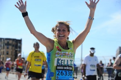 A Dana-Farber Marathon Challenge runner cheers on the course