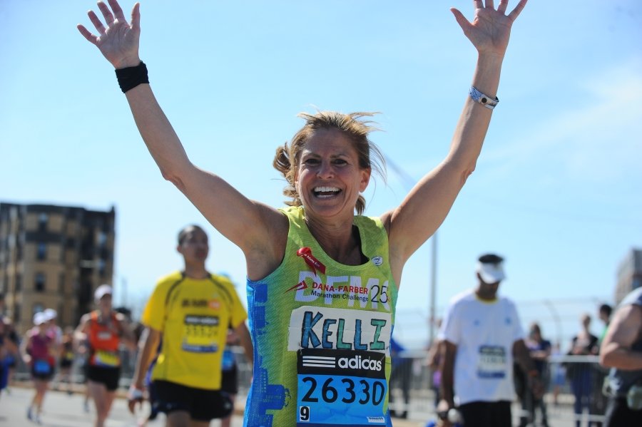 A Dana-Farber Marathon Challenge runner cheers on the course