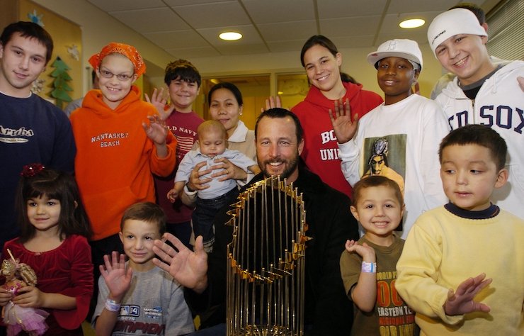 Jimmy Fund Clinic patients and Tim Wakefield with the World Series trophy