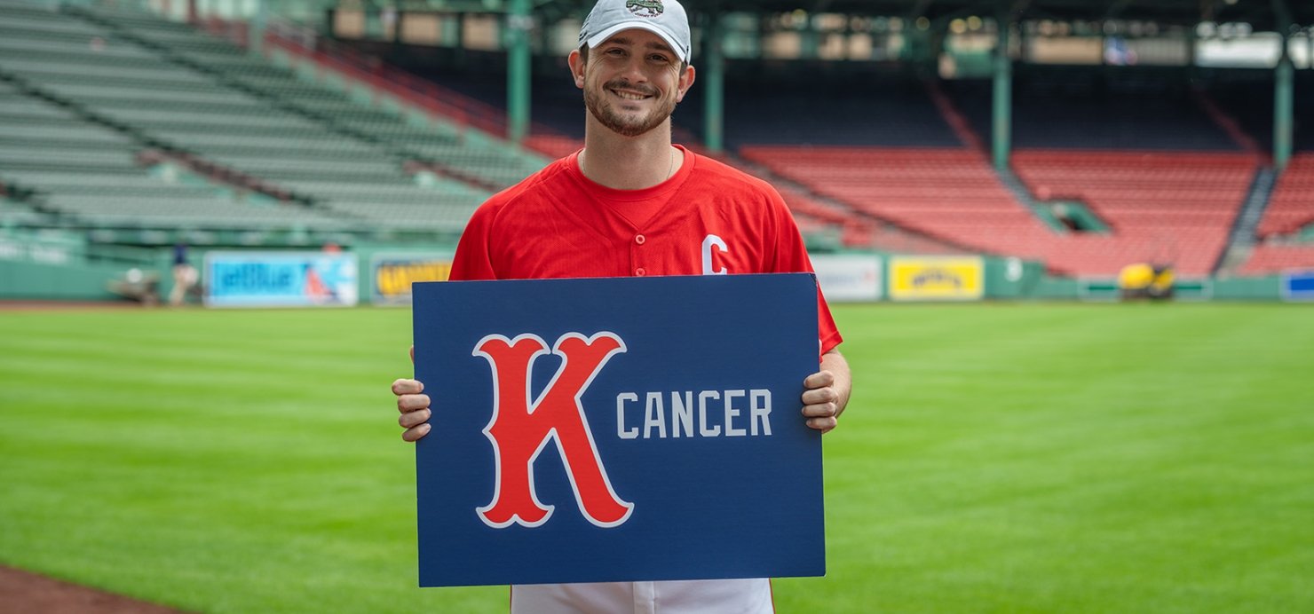 Garrett Whitlock holding a K Cancer sign at Fenway Park