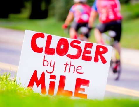 A Closer by the Mile sign on the PMC route