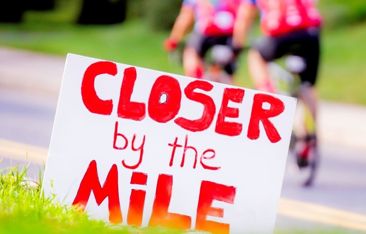 A Closer by the Mile sign on the PMC route