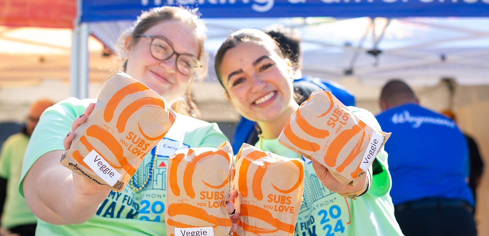 Jimmy Fund Walk volunteers hand out sandwiches