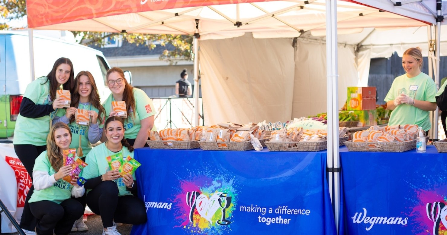Volunteers from Wegmans in front of their sponsor tent at the 2024 Jimmy Fund Walk