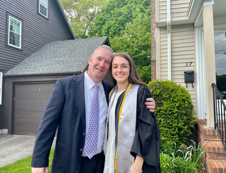 Colleen in her graduation robes with her dad