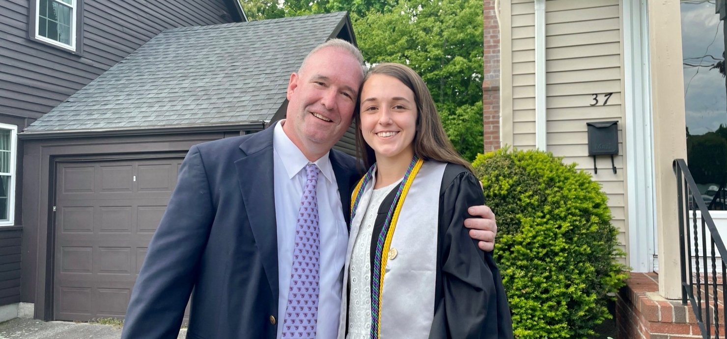 Colleen in her graduation robes with her dad
