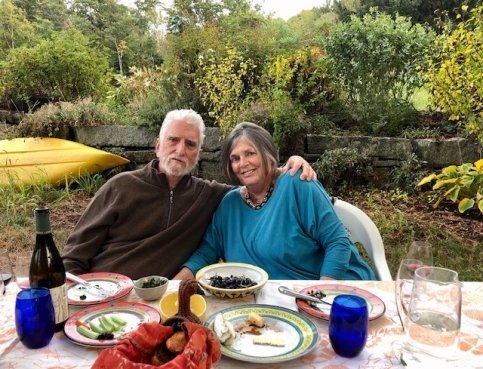 John and Mollie at a dinner table outside