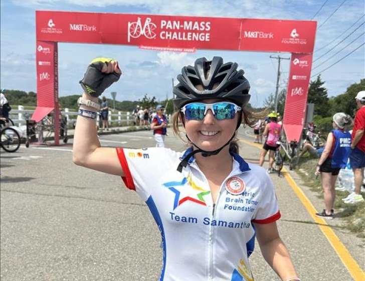 Samantha with a bike on the PMC route