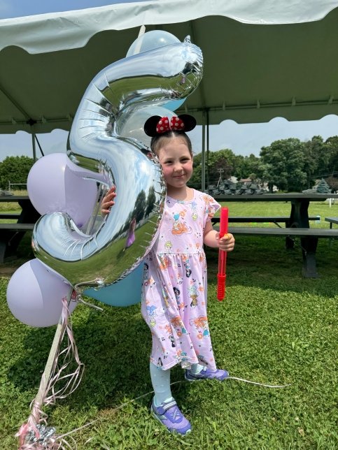 Sonnie holding a balloon