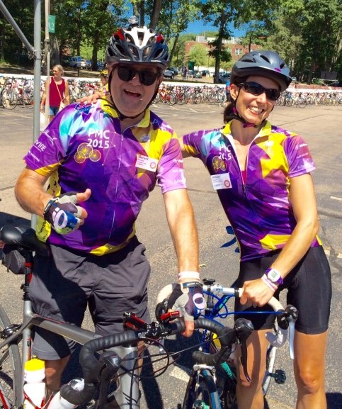 Hillary and Gerard stand with their bikes