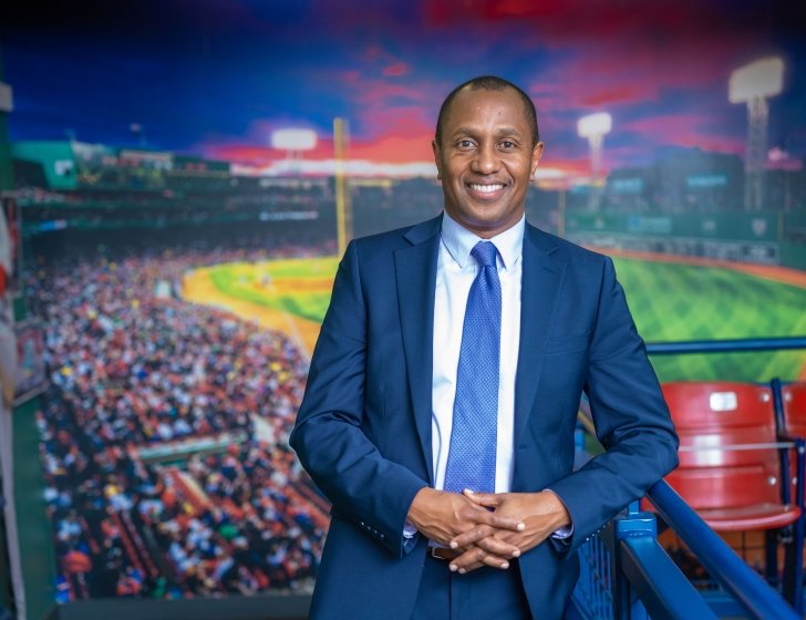 Ian Matthew-Clayton in front of a  Fenway Park image