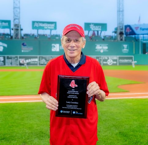 Larry at Fenway Park holding a 'Boston Red Sox Jimmy Fund Award' plaque
