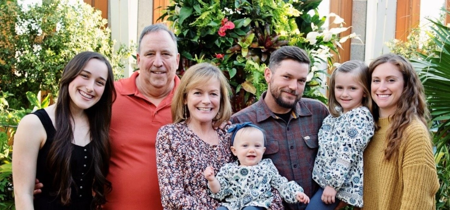 Patient and family pose together