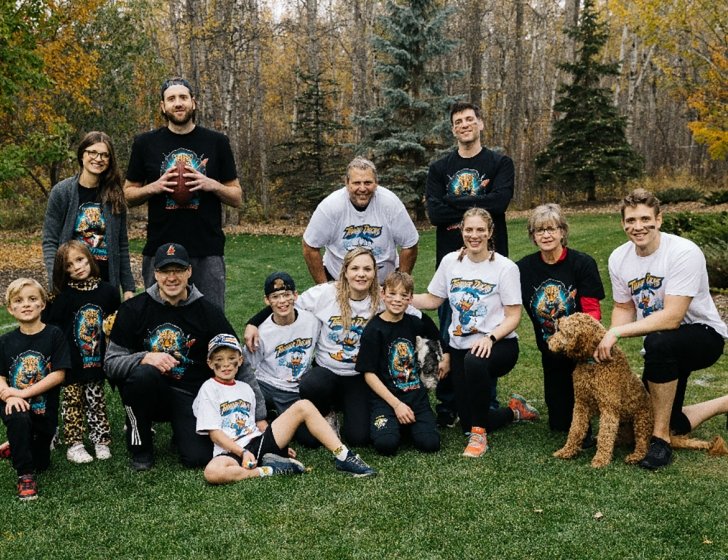 Scragg family takes a break outside during a game of football