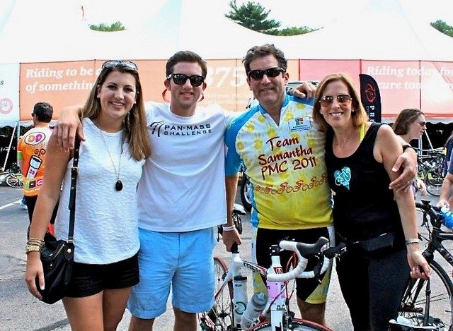 Family stands together at PMC ride