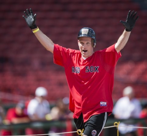Ronnie runs bases at Fenway with arms up in air