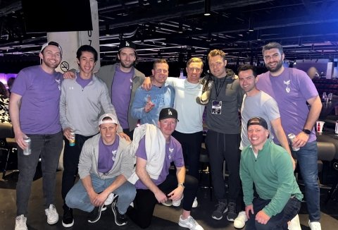 Chris surrounded by friends and family in purple “Team Devin” shirts