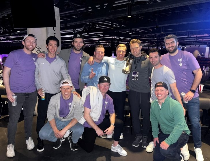 Chris surrounded by friends and family in purple 'Team Devin' shirts
