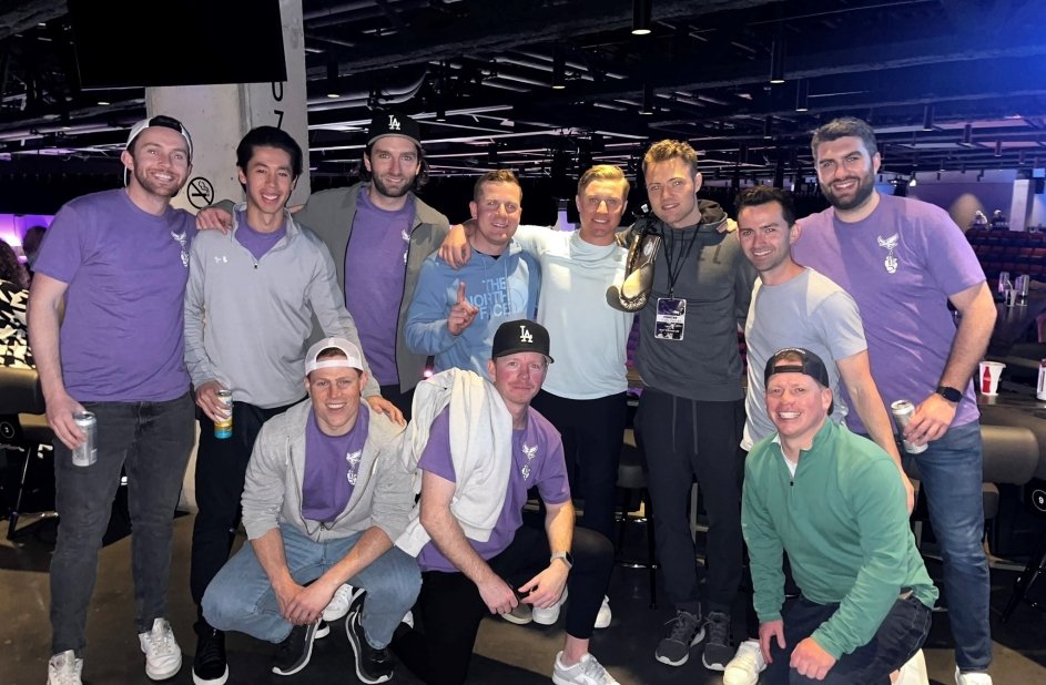 Chris surrounded by friends and family in purple 'Team Devin' shirts