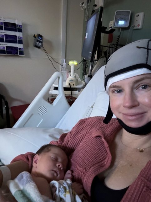 Catherine and her baby in a hospital bed