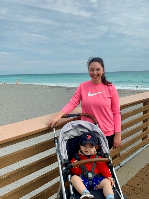 Erin and her child at the beach