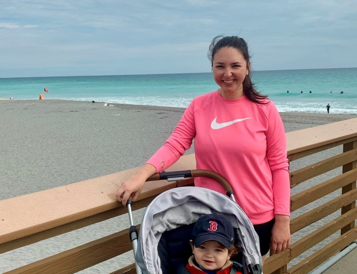 Erin and her child at the beach