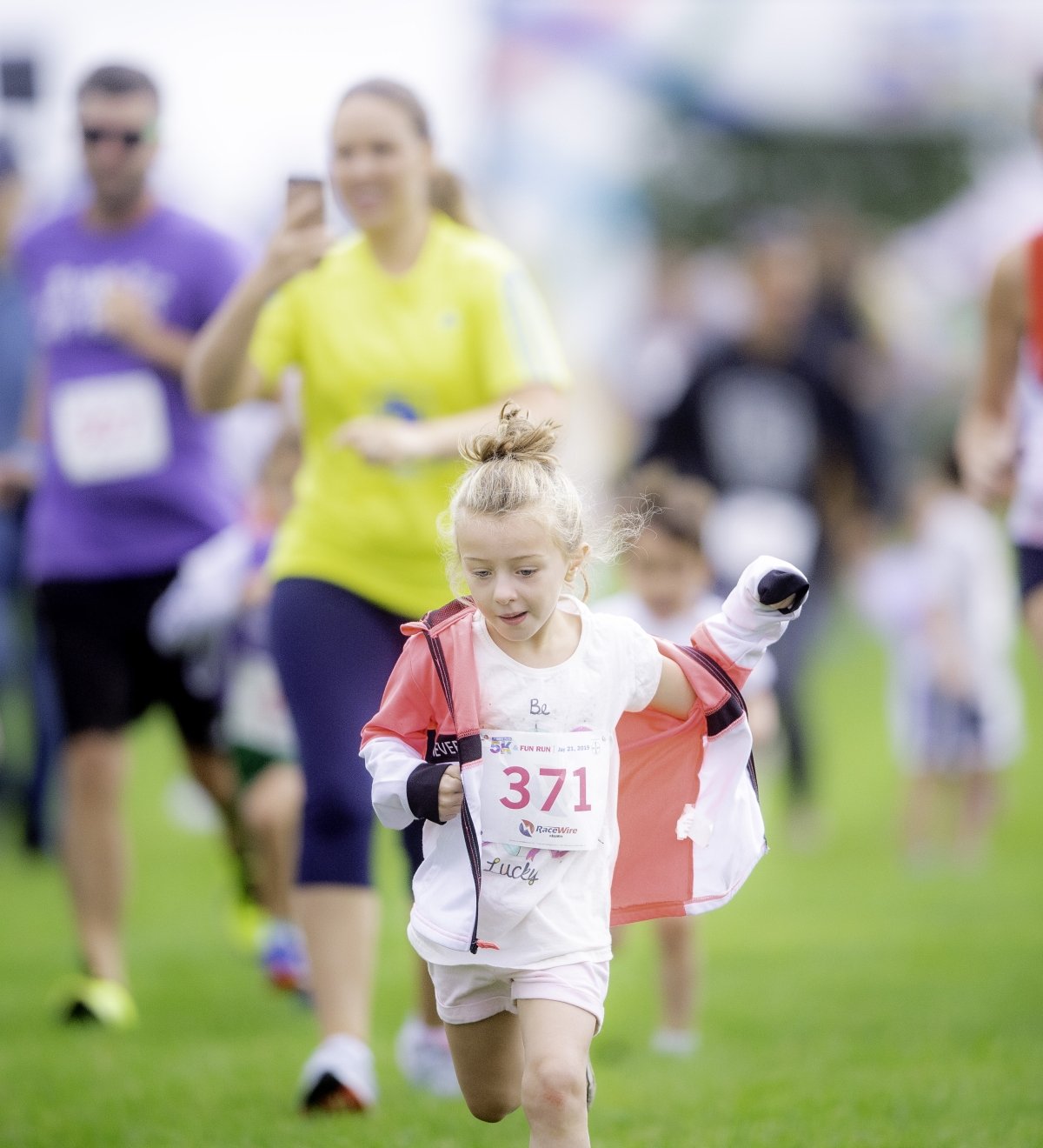Runners crossing the finish line of a community race