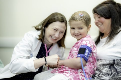 A young patient being examined by a doctor