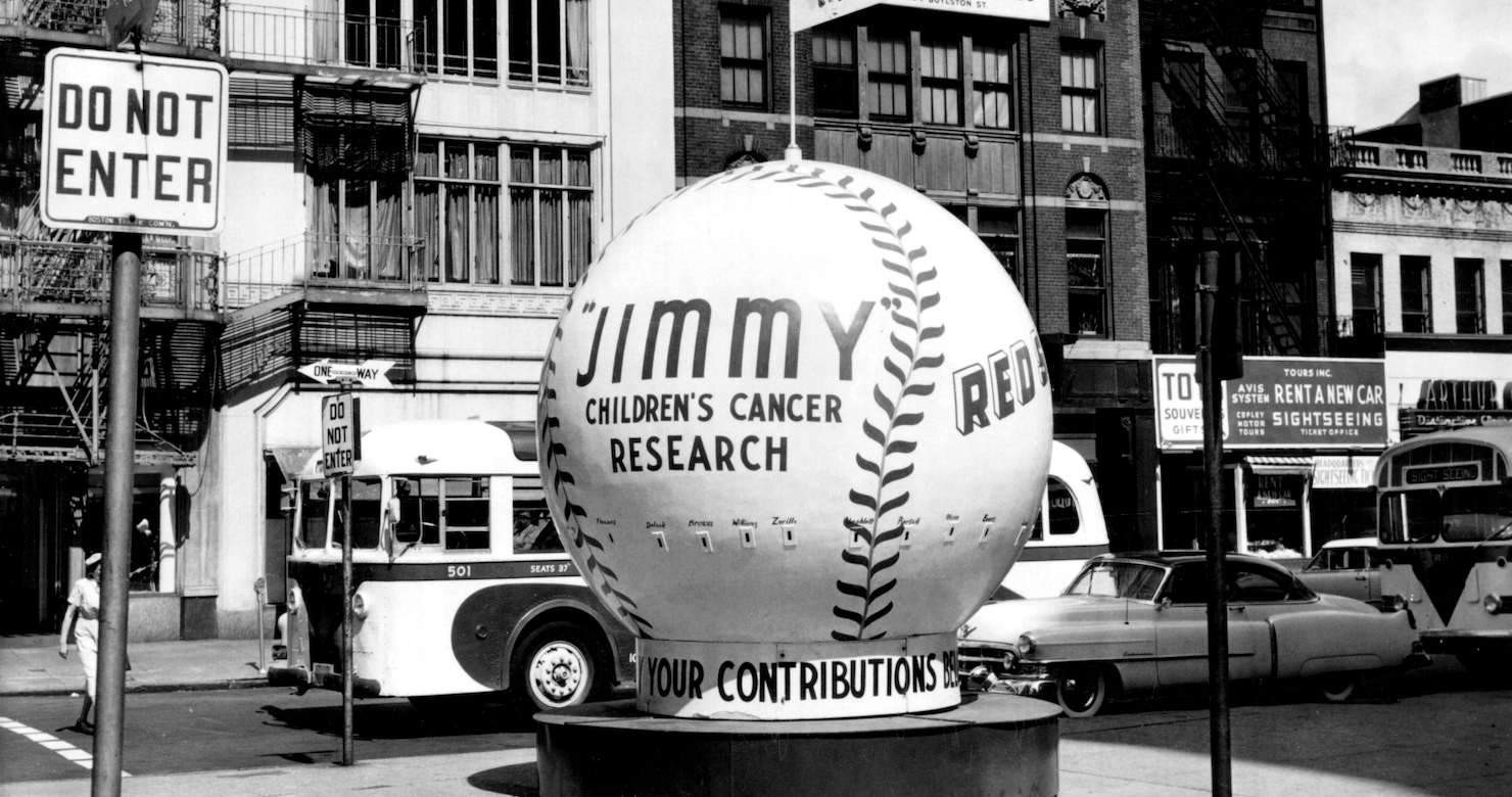 Black and white photo of a giant baseball display from the 1950s for the Jimmy Fund