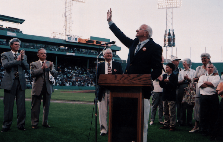 'Jimmy' waving at a podium in Fenway Park