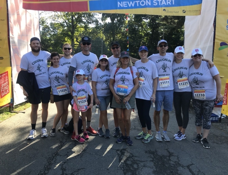 Coughlin family stands in front of Jimmy Fund Walk Newton Start Line
