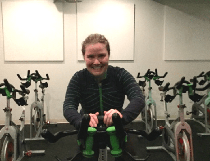 Kelly pedals a stationary bike