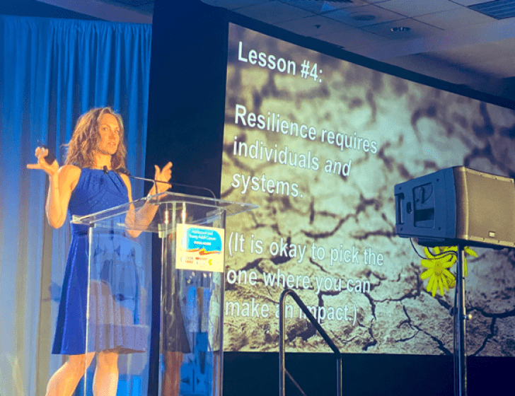 Dr. Rosenberg giving a presentation at a conference